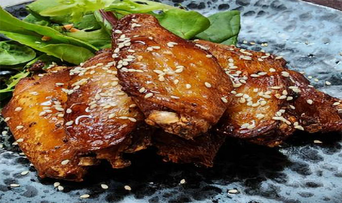 Fried chicken mid-wings with lemon and honey
